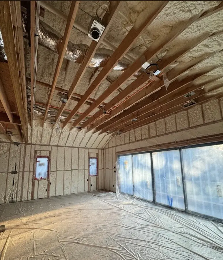 Interior walls and ceiling insulated with spray foam during new construction in Palmyra
